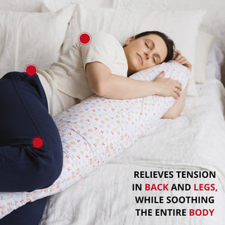  C-shape maternity pillow with organic milk white cotton cover on a bed